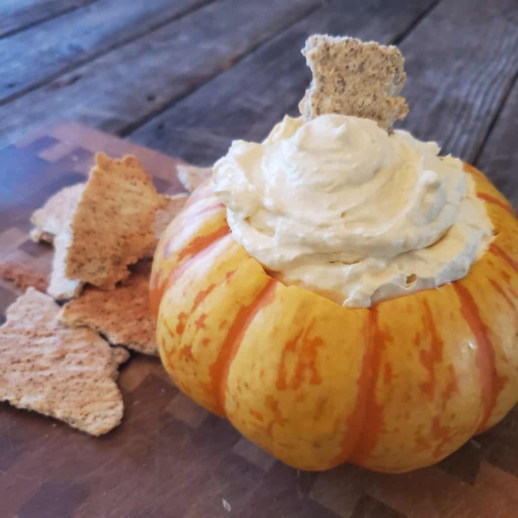 pumpkin pie fluff on a table in a pumpkin 