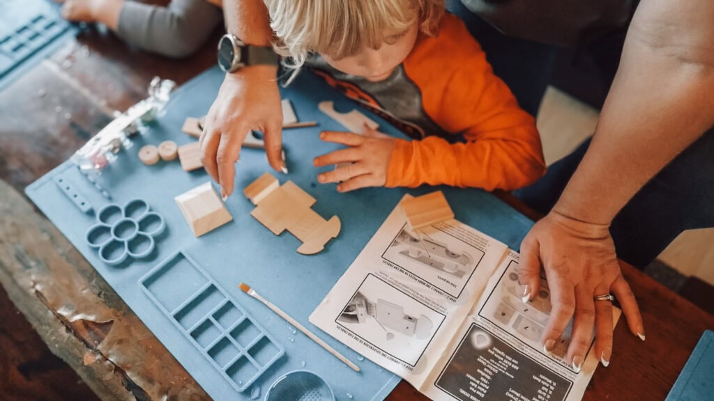 Cultivating a grateful heart - mom helping kids with school an painting